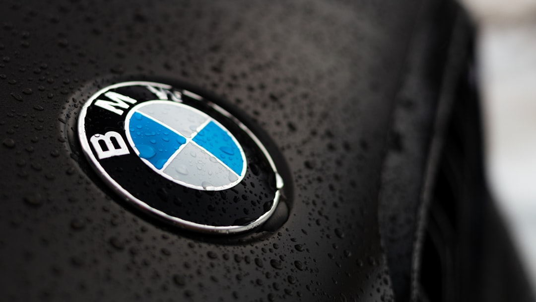 a close up of a bmw emblem on a black jacket