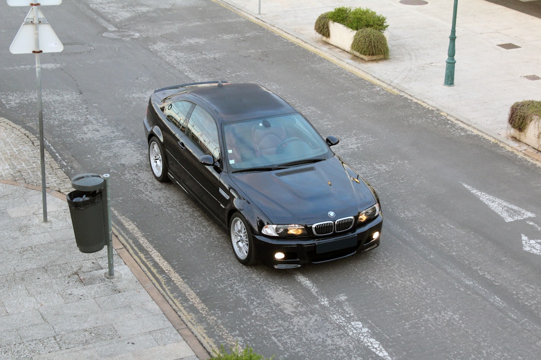 black bmw car on road during daytime