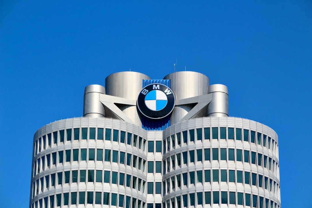 a tall building with a bmw logo on top of it