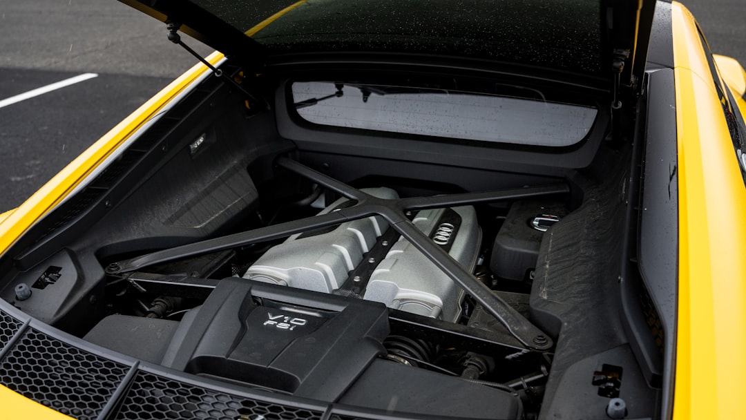 the engine compartment of a yellow sports car