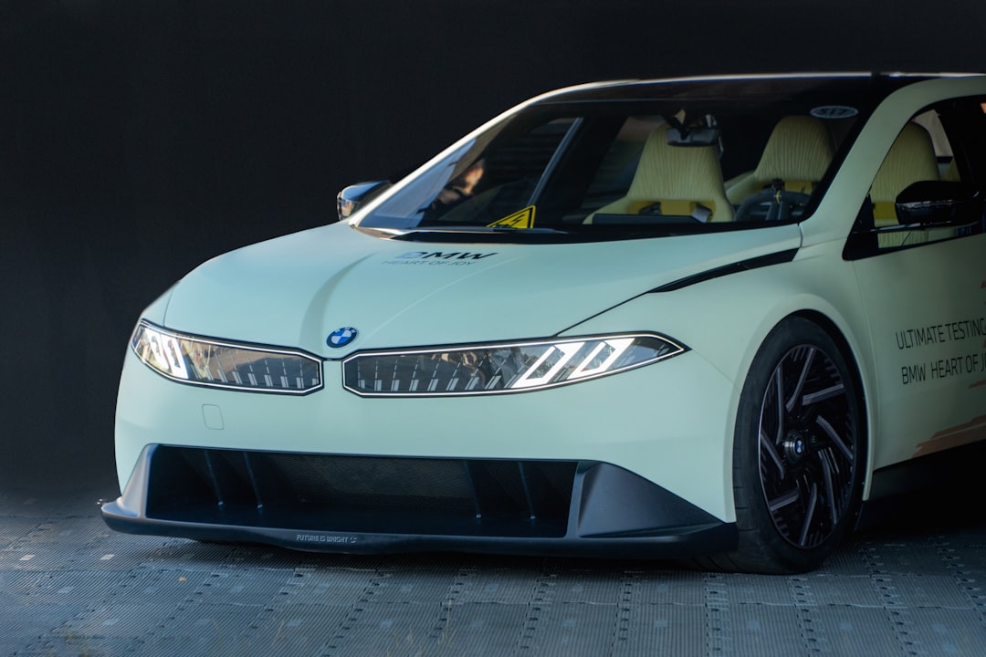 A white BMW car is shown.