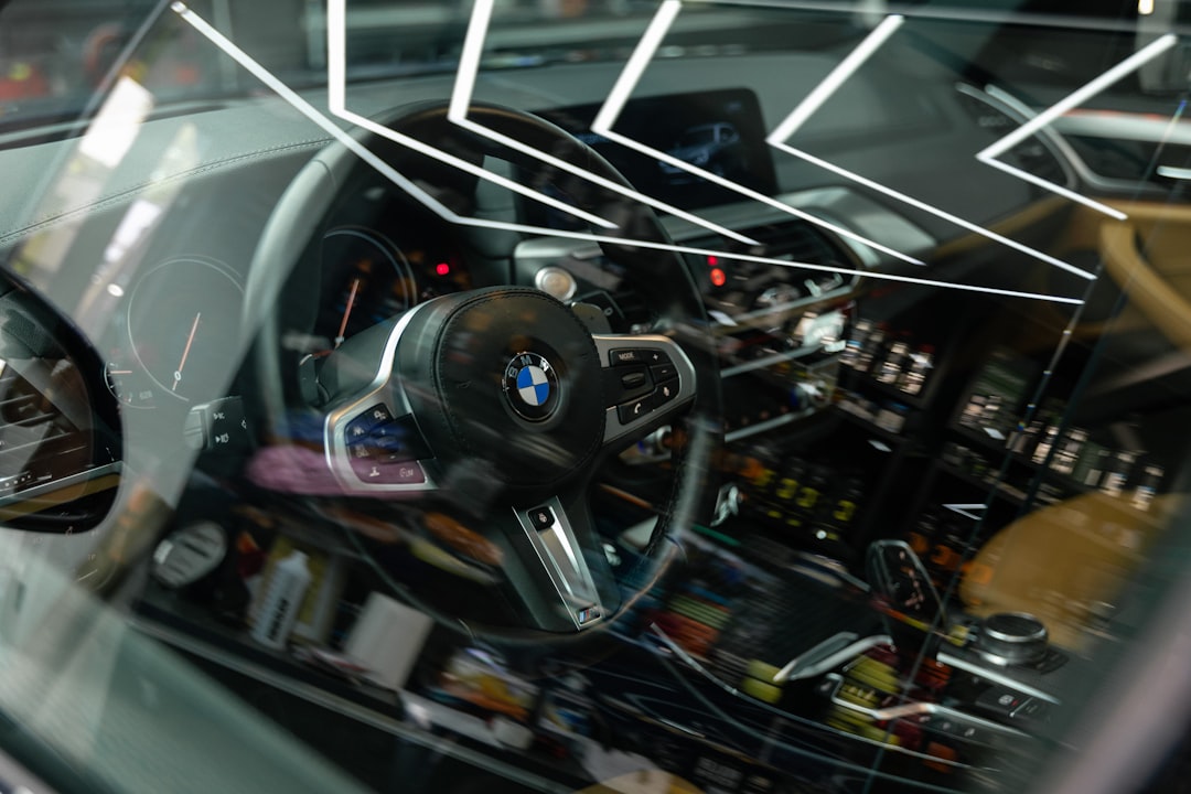 the interior of a car with a steering wheel and dashboard