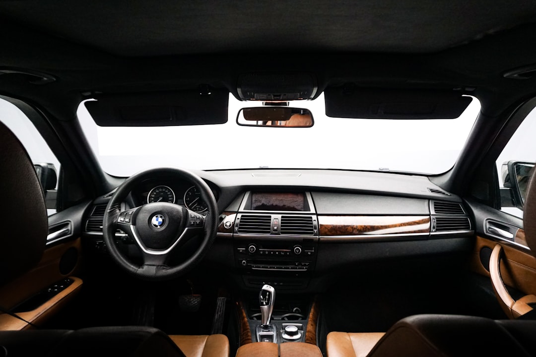 the interior of a bmw car with brown leather seats