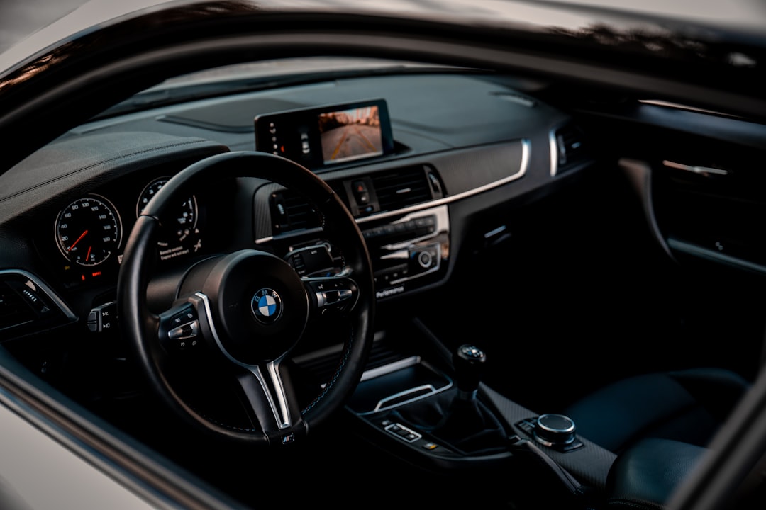 the inside of a car with a dashboard and steering wheel