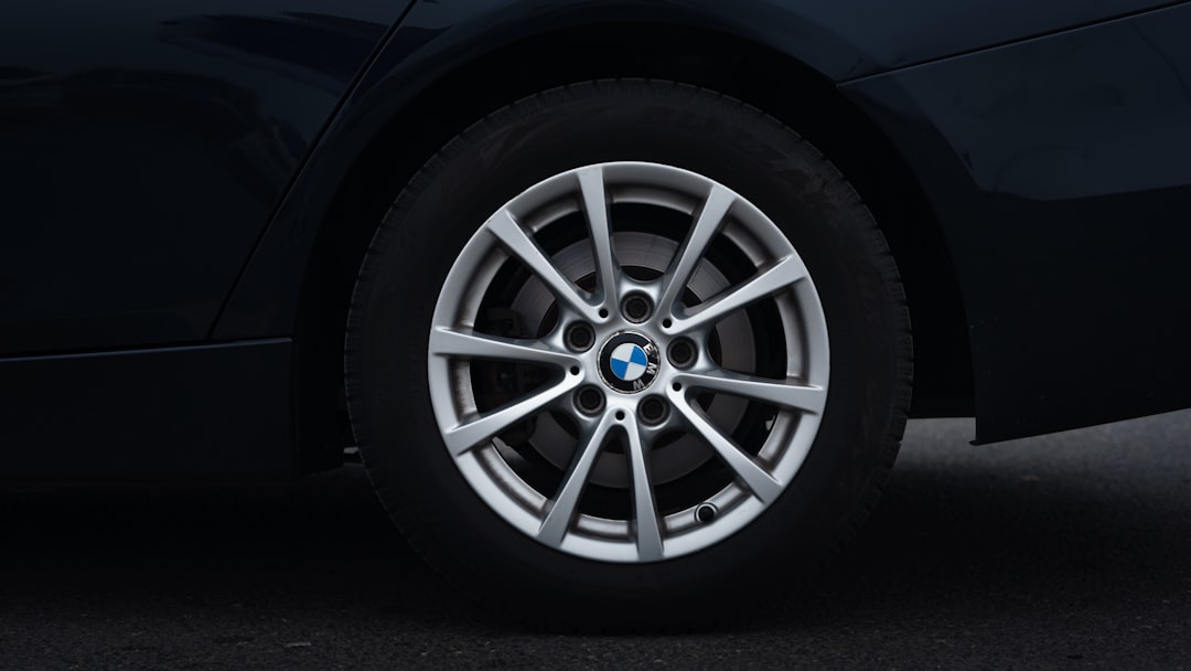 A close up of a car wheel on a street