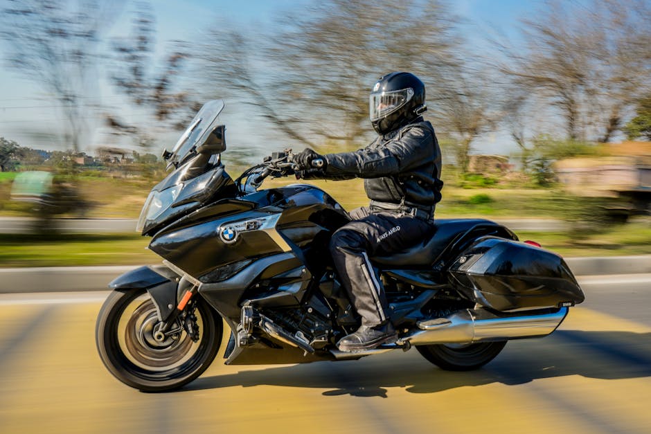 A man rides a motorcycle at speed in Indianapolis, showcasing dynamic motion and focus.
