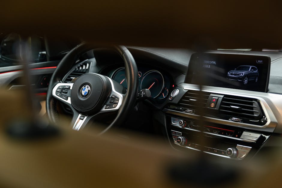 Detailed view of a BMW car interior showcasing the dashboard and steering wheel.